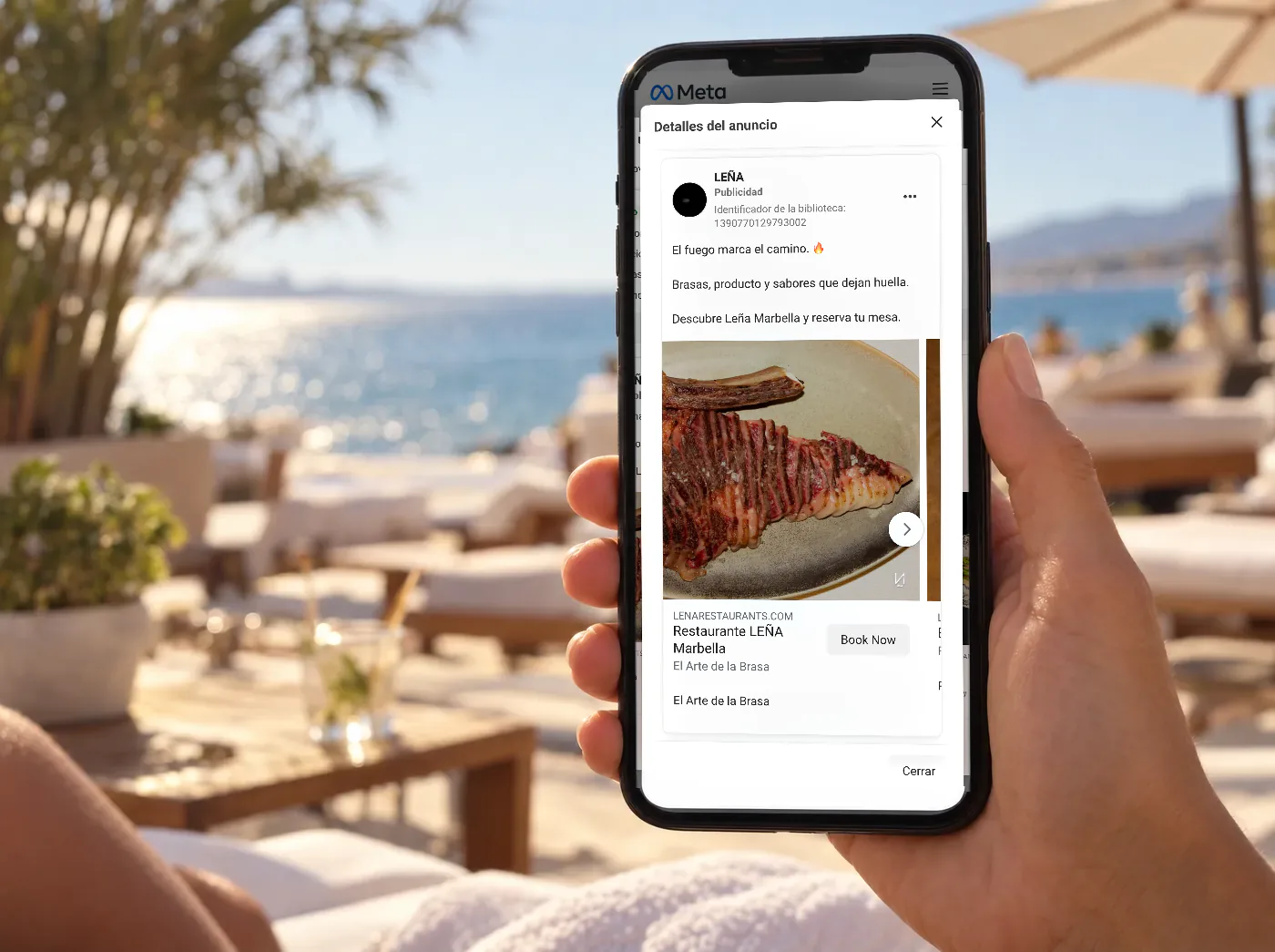 Móvil con el anuncio de un restaurante de Marbella, LEÑA, en la Biblioteca de anuncios de Meta